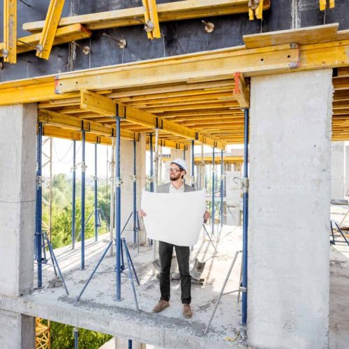 Man with house drawings on the structure