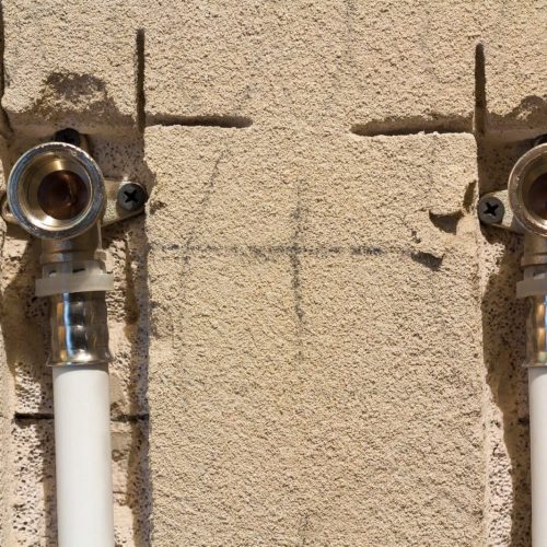 Water pipes made of polypropylene in the wall, plumbing in the house. Installation of sewer pipes in